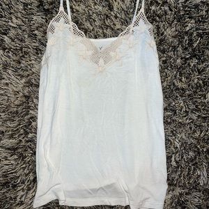 American Eagle. Size small. White tank top with floral and net like top.